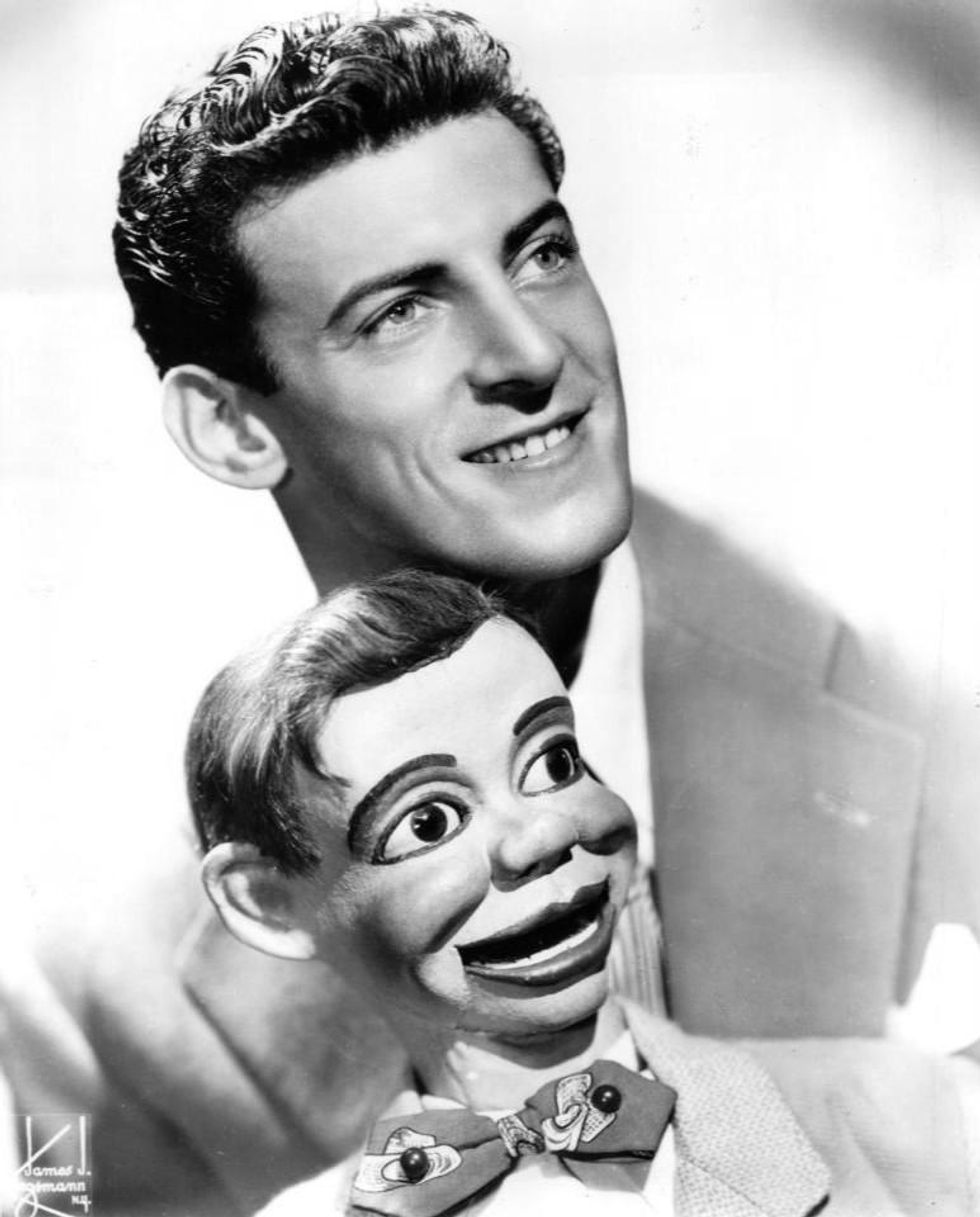 Black and white photo of Paul Winchell holding a dummy